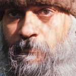 Osho with brown hat
