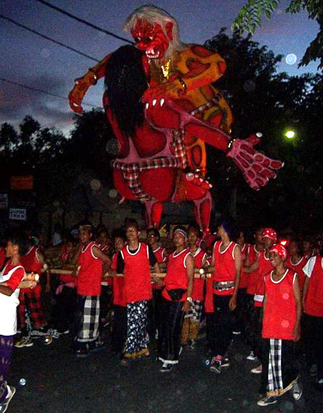 Ogoh-Ogoh being carried by the boys