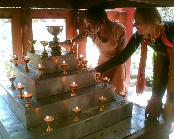 Lighting butter lamps for Disha’s puja