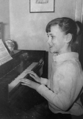 The future songstress practicing piano at age ten.