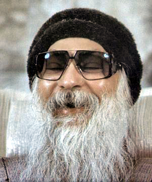 Osho laughing during discourse