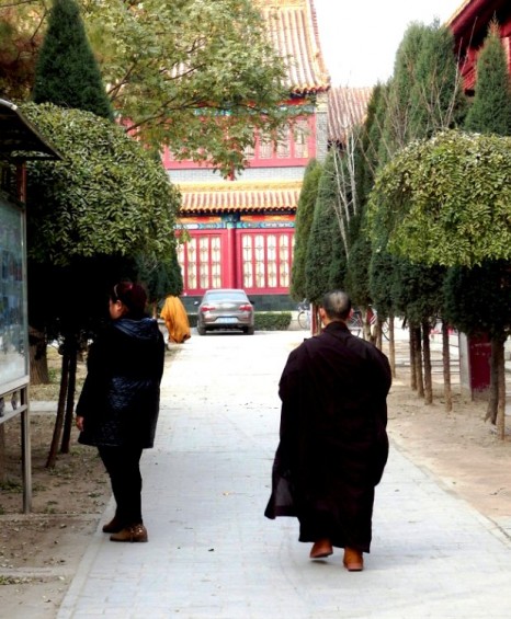 A late monk running for a ceremony