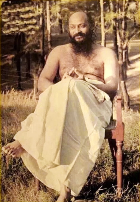 Osho sitting in forest