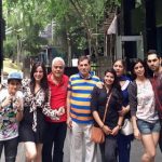 Family in front of Gates Feat