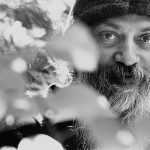 Osho behind plants