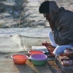 Man with begging bowls