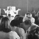 Osho gives a lecture in Buddha Hall