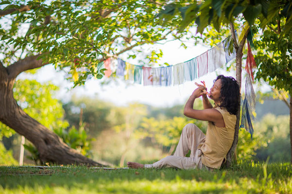 Manose playing the flute in Gayatri Mandir, Corfu