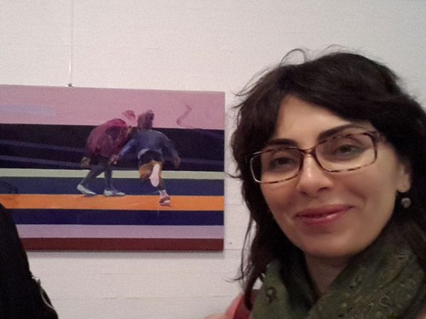 Bramaghati, one of Risk’s visitors, in front of a playground painting by Nirvi.