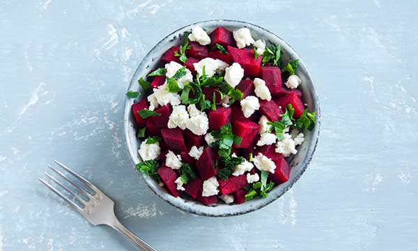 A beet and Feta cheese salad with parsley.