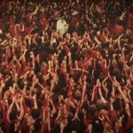 Osho surrounded by disciples in Rajneesh Mandir