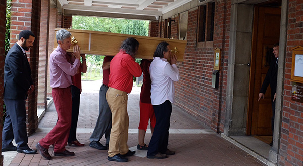 Parmartha's coffin being carried