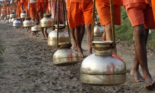Men carrying water vessels