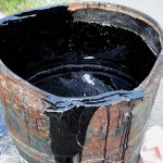 Bucket with tar