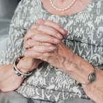 Elderly woman praying