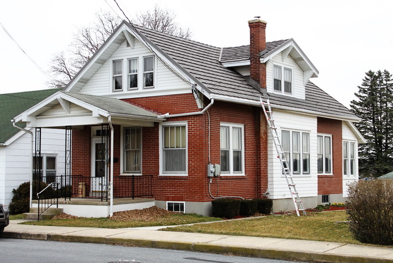 Ladder leaning on house