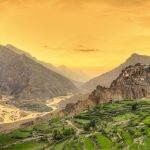 The Dankar Monastry sitting by the lush meadows and a glorious sunset
