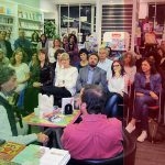 Azima being interviewed in a bookshop in Palermo, 2019
