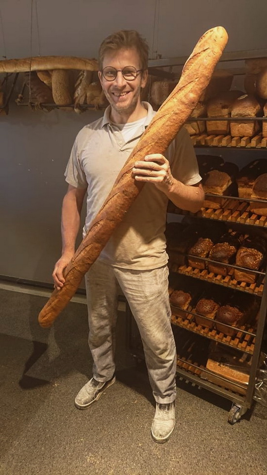 Baker with lng baguette