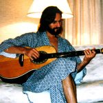 Strumming my guitar in a Singapore hotel, 2000