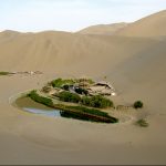 Aerial view of the Mingsha Mountains and the crescent lake