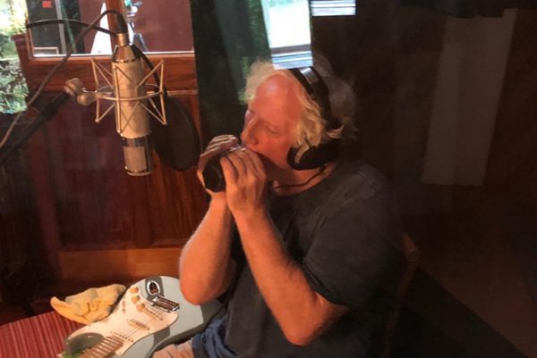 Our Baba Julian plying blues harp on 'Bring me your love'