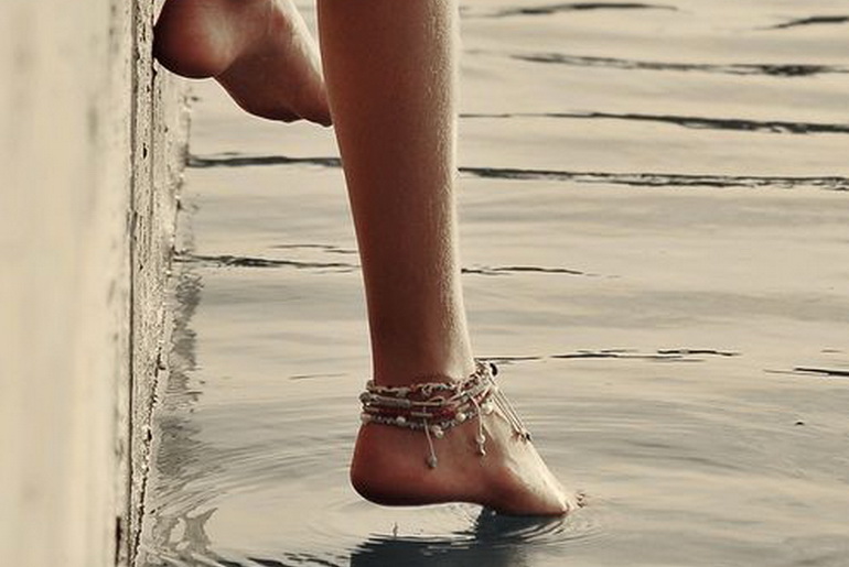 Child stepping into water