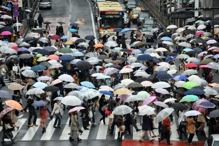 crowd with umbrellas