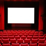 Cinema with Red Seats and Blank Screen