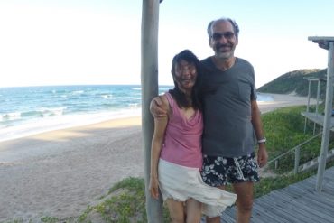 Meera with Svagito on beach in South Africa