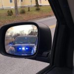 Blue lights in rearview mirror