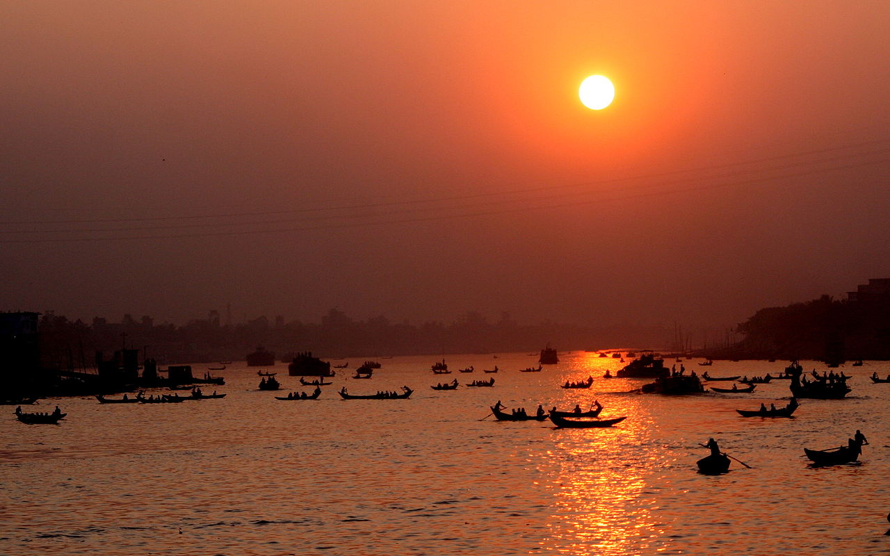 Boats crossing the river Buriganga