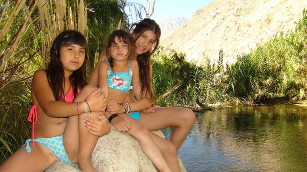 My daughters, Kiara, Celeste, Aurora by the river in Elqui