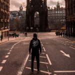 Man standing in street in Edinburgh