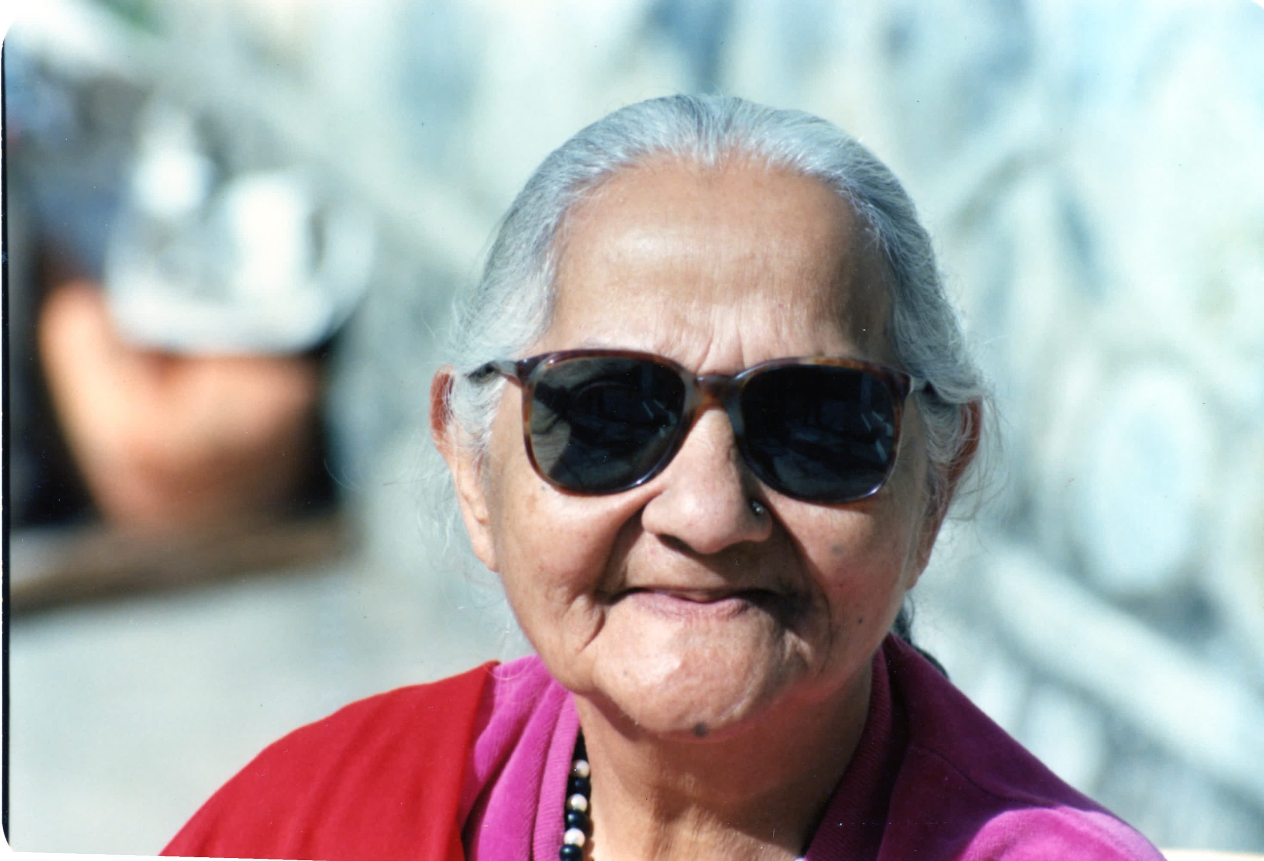 Mataji with sun glasses Osho News