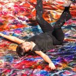 Meera lying on painting