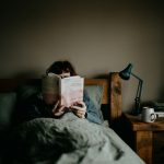 woman reading in bed