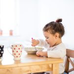 Girl eating breakfast