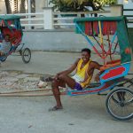 When not in use, rickshaws make very comfortable resting places.