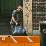 Man with garbage bag