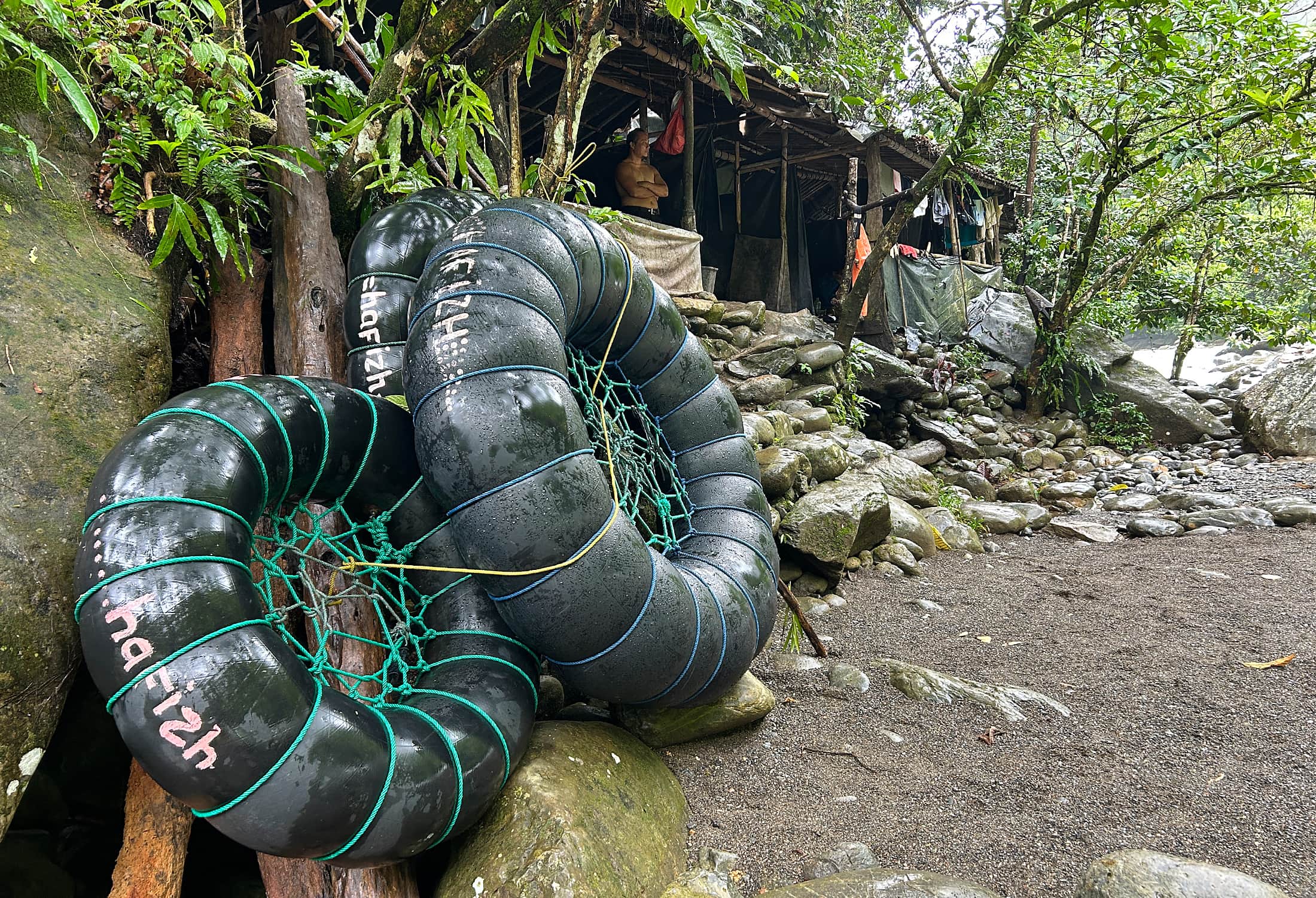 Wet tyres leaning against wall