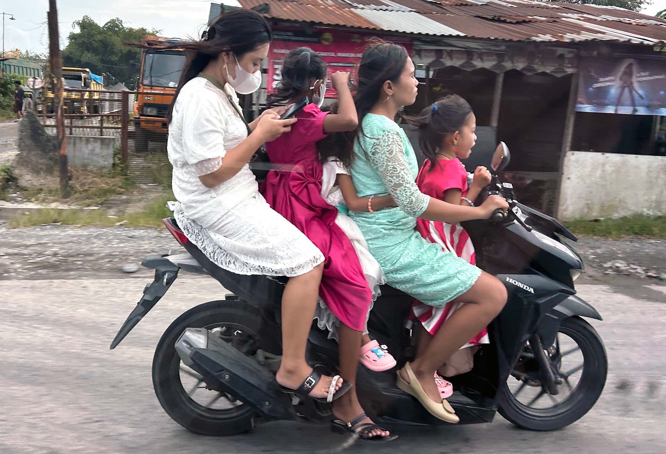 Four women on scooter