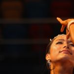 Dancer touching third eye