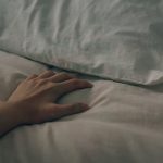 Hand on pillow