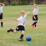 Children playing soccer